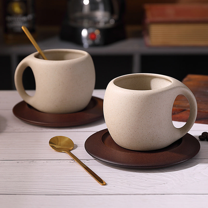 Two ceramic cup-and-wood-saucer sets shown for styling; listing is for one set, spoons excluded