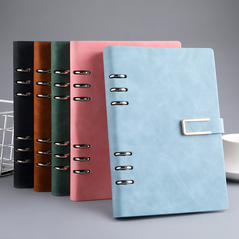 Lake-blue A5 notebook with U-shaped buckle, with alternative colours behind