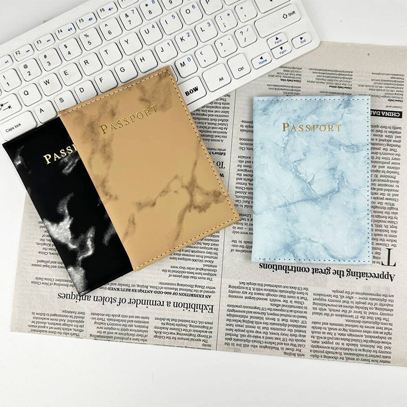 Marbled passport covers in brown, black and blue-white