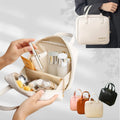 Ivory shell makeup organiser shown open, with cosmetics for styling